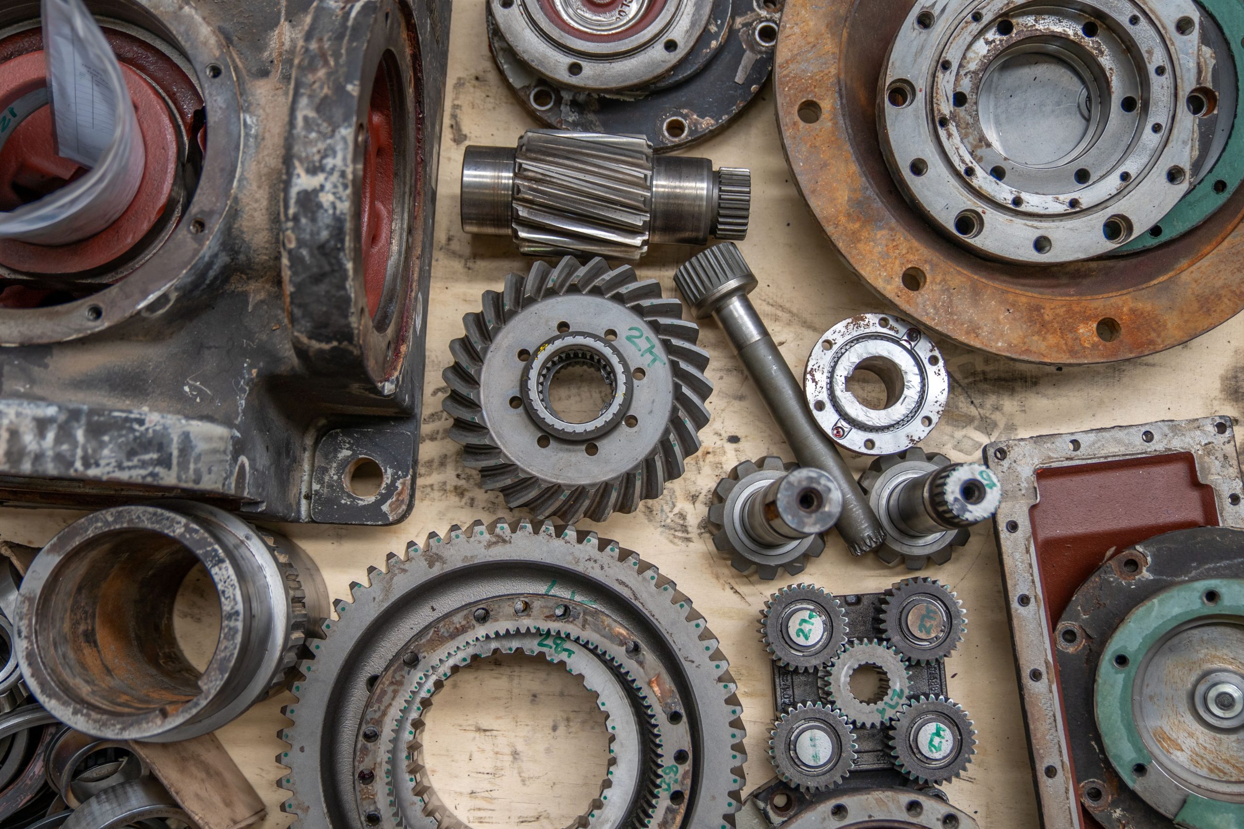 Disassembled gears, shafts and housings shown as mechanical component references